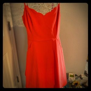Orange scallop detail mini dress with open back